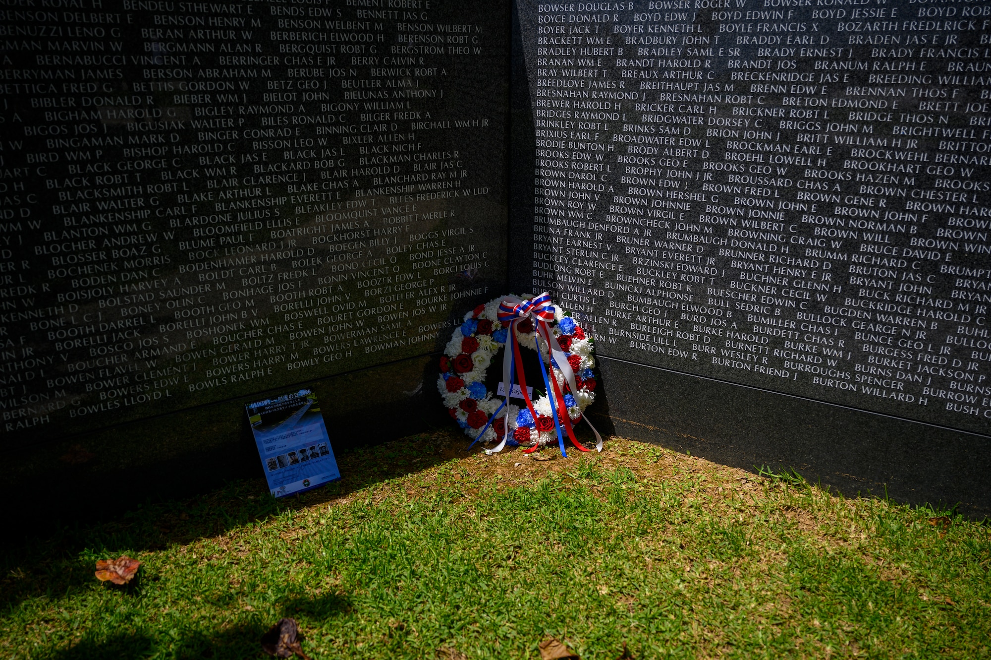 A ceremonial wreath rests before the engraved names at “The Cornerstone of Peace” during an Okinawa Memorial Day ceremony in Peace Memorial Park, Okinawa, Japan, June 23, 2026. The annual ceremony, hosted by the American Chamber of Commerce in Okinawa and USO Okinawa, commemorates the end of the Battle of Okinawa and honors those who lost their lives during the conflict. (U.S. Air Force photo by Airman 1st Class Francisco Huerta)