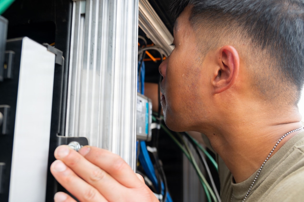 U.S. Air Force Senior Airman Physa Muon, 776th Expeditionary Air Base Squadron radar, airfield, and weather systems technician performs maintenance inside an equipment cabinet at Chabelley Airfield, Djibouti, May 19, 2026. The RAWS technicians meticulously service these critical communication assets to ensure uninterrupted air-to-ground and ground-to-ground radio connections between air traffic control personnel and inbound aircraft operating throughout the region. (U.S. Air Force photo by Senior Airman Luis Gomez)