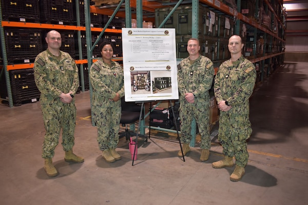 Williamsburg, VA - NMRLC hosted facility tours during the 2026 Navy Medicine Logistics Symposium that spanned much of the Hampton Roads, Tidewater, VA area. Preparing to brief visitors on the Expeditionary Resuscitative Surgical Suite (ERSS) and the En Route Care System (ERCS) were HM1 Skyler Holt, LS1 Sherrion Robinson, NMRLC Expeditionary Medical Logistics director Lt. Cmdr. Jason Kouche, and Lt. Cmdr. Jeremy Wilkinson.
