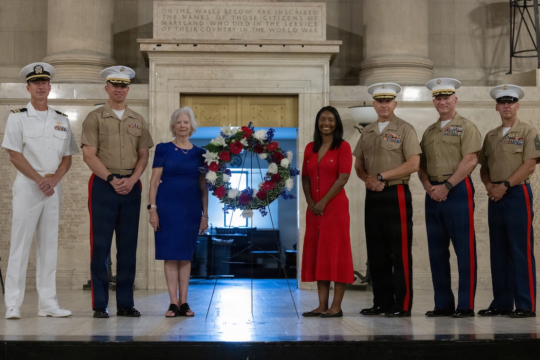 U.S. service members and local authorities pose for a group photo during a wreath-laying ceremony as part of SAIL250 in Baltimore, Maryland, June 26, 2026. SAIL250 Maryland and Airshow Baltimore celebrate America’s maritime heritage and the nation’s 250th anniversary by bringing together U.S. and international ships, Marines, Sailors, and community partners throughout Baltimore’s waterfront.  (U.S. Marine Corps photo by Lance Cpl. Michael Robinson)
