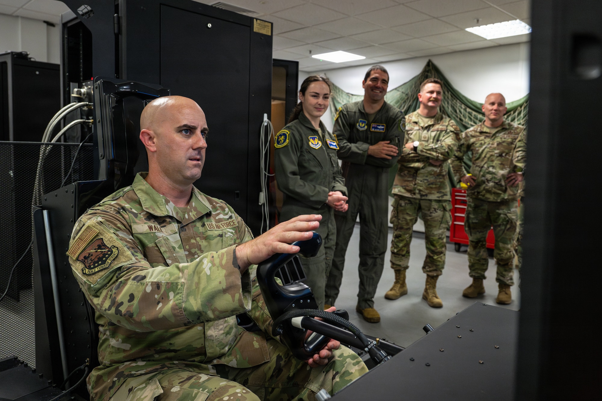 U.S. Air Force Chief Master Sgt. James Wall, 100th Air Refueling Wing command chief, uses a reduced oxygen breathing device simulator during an aerospace physiology demonstration at RAF Mildenhall, England, June 25, 2026.