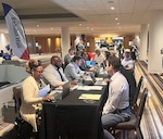2026 NCMS Annual Seminar highlighing the DCSA NBIS and DISS support desks, Atlanta, Ga., June 8, 2026 (DOW Courtesy Photo).