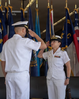 U.S. Navy Capt. Elizabeth Adriano, commanding officer of Navy Medicine Readiness and Training Command San Diego, salutes Capt. Ian Fowler, departing commander of Expeditionary Medical Facility 150-Bravo, during a change of command ceremony, at Navy Medicine Readiness and Training Command San Diego, June 26. NMRTC San Diego supports Navy and Marine Corps readiness by ensuring its medical forces are ready to deploy and provide medical support, ashore or at sea. (U.S. Navy photo by Mass Communication Specialist 3rd Class Jason Afable)