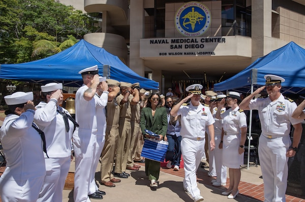 U.S. Navy Ian Fowler, departing commanding officer of Expeditionary Medical Facility 150-Bravo, salutes attendees following a change of command ceremony, at Navy Medicine Readiness and Training Command San Diego, June 26. NMRTC San Diego supports Navy and Marine Corps readiness by ensuring its medical forces are ready to deploy and provide medical support, ashore or at sea. (U.S. Navy photo by Mass Communication Specialist 3rd Class Jason Afable)