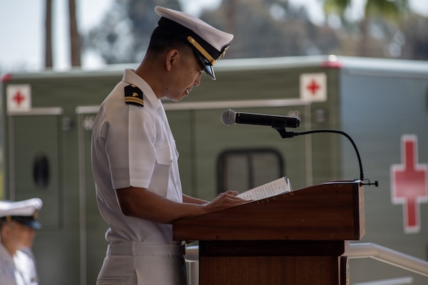 U.S. Navy Lt. David Kong, chaplain, delivers the benediction during a change of command ceremony for Expeditionary Medical Facility 150-Bravo, at Navy Medicine Readiness and Training Command San Diego, June 26. NMRTC San Diego supports Navy and Marine Corps readiness by ensuring its medical forces are ready to deploy and provide medical support, ashore or at sea. (U.S. Navy photo by Mass Communication Specialist 3rd Class Jason Afable)