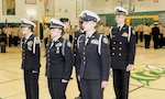 The command staff of the Great Mills High School Navy Junior Reserve Officers Training Corps (NJROTC) unit stands at attention during their Annual Military Inspection (AMI). The rigorous annual event evaluates cadets on military bearing, discipline, uniform appearance, and naval knowledge. Personnel from Navy Medicine Readiness and Training Command (NMRTC) Patuxent River supported the inspection as guest inspectors and mentors, reinforcing the strong community partnership between the U.S. Navy and the next generation of leaders.