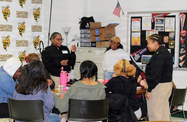 Capt. Teresita Alston, former Executive Officer of Navy Medicine Readiness and Training Command (NMRTC) Patuxent River, leads a hands-on dental demonstration for students at the Great Mills High School Career Center. During the interactive session, Alston guided students as they worked with typodonts and curing lights, providing practical insight into the field of Navy dentistry and highlighting career opportunities within the service. Capt. Alston is in process of moving to the West Coast as she will soon be the Commanding Officer for Navy Medicine Readiness and Training Command Oak Harbor.