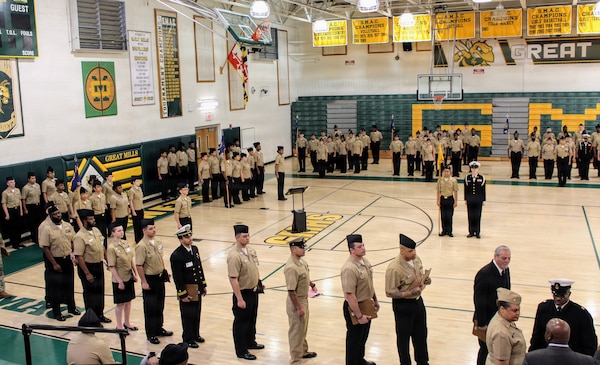Sailors assigned to Navy Medicine Readiness and Training Command (NMRTC) Patuxent River line up for their inspection assignments during the Great Mills High School Navy Junior Reserve Officers Training Corps (NJROTC) Annual Military Inspection (AMI). The NMRTC Patuxent River team volunteered to serve as guest inspectors, evaluating cadets on military bearing, uniform appearance and general knowledge. This collaborative effort provides active-duty personnel a meaningful platform to share their professionalism while directly inspiring the next generation of potential leaders