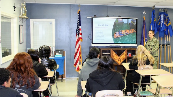 Chief Petty Officer Amanda Ellis, assigned to Navy Medicine Readiness and Training Command (NMRTC) Patuxent River, speaks with Air Force Junior Reserve Officers Training Corps (AFJROTC) cadets at Chopticon High School. The visit initiated a series of spring semester educational engagements designed to build community partnerships and introduce students to career pathways within Navy Medicine.