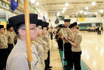 Hospital Corpsman 1st Class Timothy Scull, assigned to Navy Medicine Readiness and Training Command (NMRTC) Patuxent River, inspects cadets from the Great Mills High School Navy Junior Reserve Officers Training Corps (NJROTC) during their Annual Military Inspection (AMI). Scull served as a guest inspector, evaluating cadets on military bearing, uniform appearance, and general knowledge. The command's participation highlights its commitment to community outreach and developing the next generation of leaders.