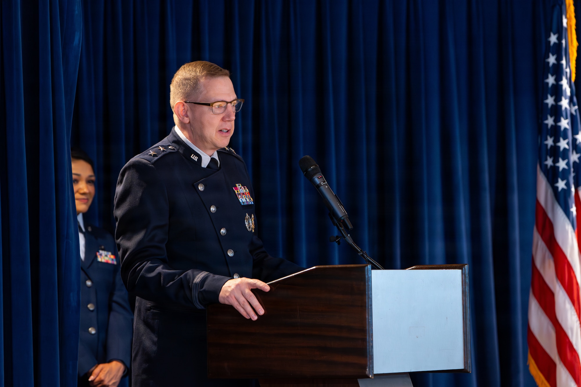 U.S. Space Force Maj. Gen. James E. Smith, commander of Space Training and Readiness Command, addresses attendees during an Officer Training Course graduation ceremony at Peterson Space Force Base, Colorado, June 26, 2026.