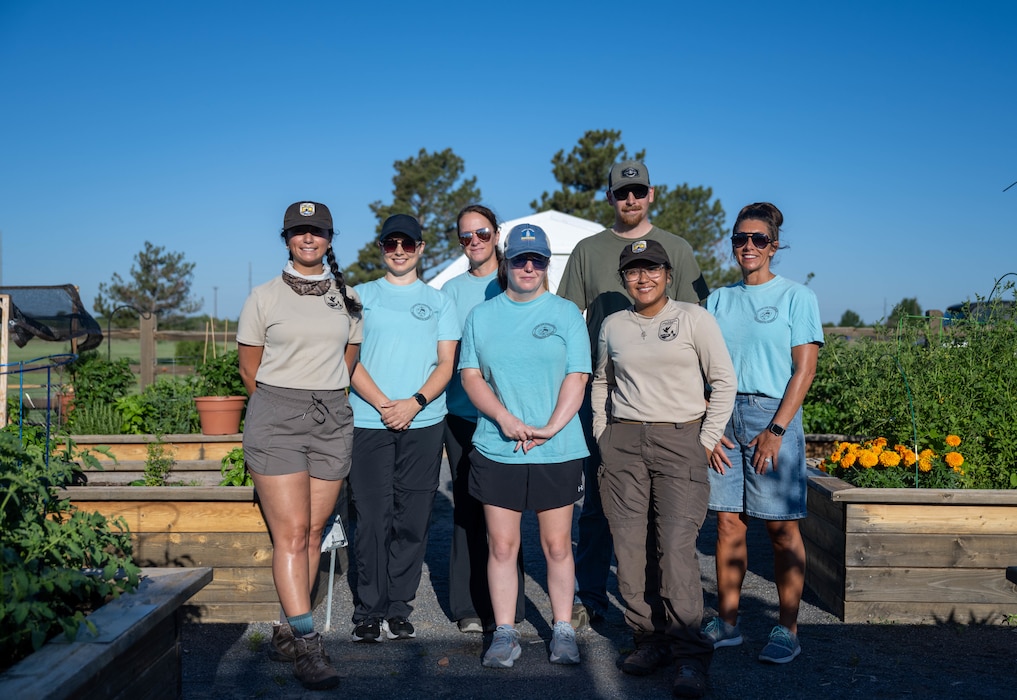 Members of the U.S. Fish and Wildlife Service and Altus’ environmental team stand in the community garden during BioBlitz at Altus Air Force Base, Oklahoma, June 17, 2026. These wildlife biologists and environmental specialists hosted children and community members for the second annual BioBlitz. (U.S. Air Force photo by Airman 1st Class Emma Wright)
