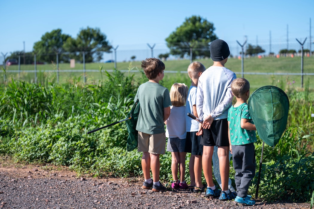 Children stand together while participating in BioBlitz at Altus Air Force Base (AFB), Oklahoma, June 17, 2026. Children were given the opportunity to find and document different insects, plants, and wildlife specifically across Altus AFB. (U.S. Air Force photo by Airman 1st Class Emma Wright)