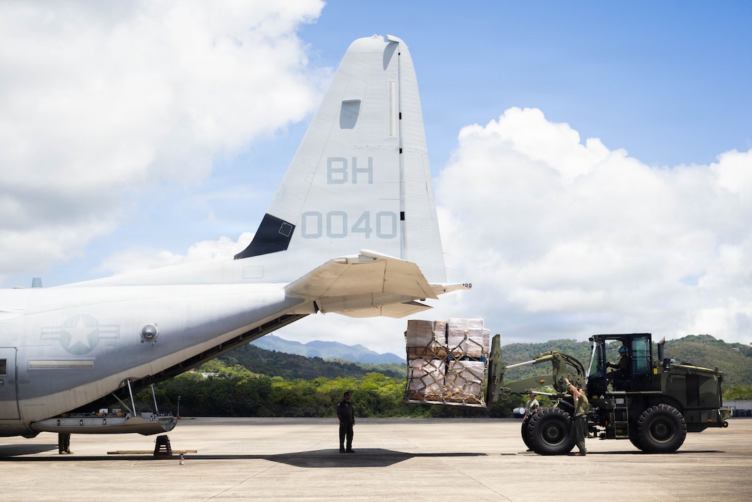 U.S. Marines with Littoral Combat Force 24 load supplies onto a KC-130J Super Hercules with Marine Aerial Refueler Transport Squadron (VMGR) 252 on Jose Aponte De La Torre Airport in Ceiba, Puerto Rico, June 27, 2026. At the direction of U.S. Southern Command, assigned U.S. military forces are supporting Department of State-led U.S. disaster assistance to the people of Venezuela in the aftermath of the June 24, 2026, earthquakes. (U.S. Marine Corps photo)