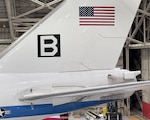 An E-4B Nightwatch sits in a hangar