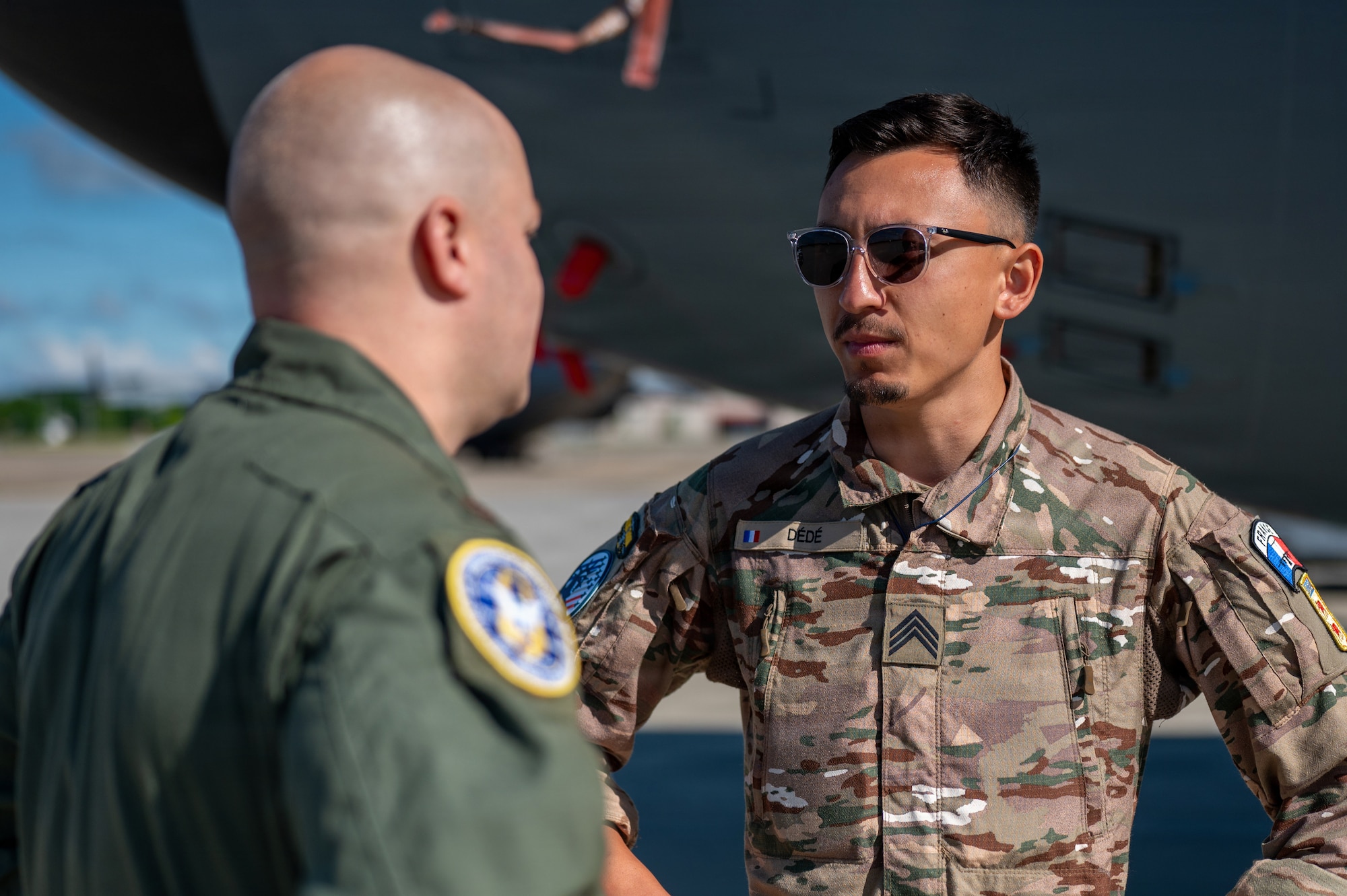 Two service members talk to each other