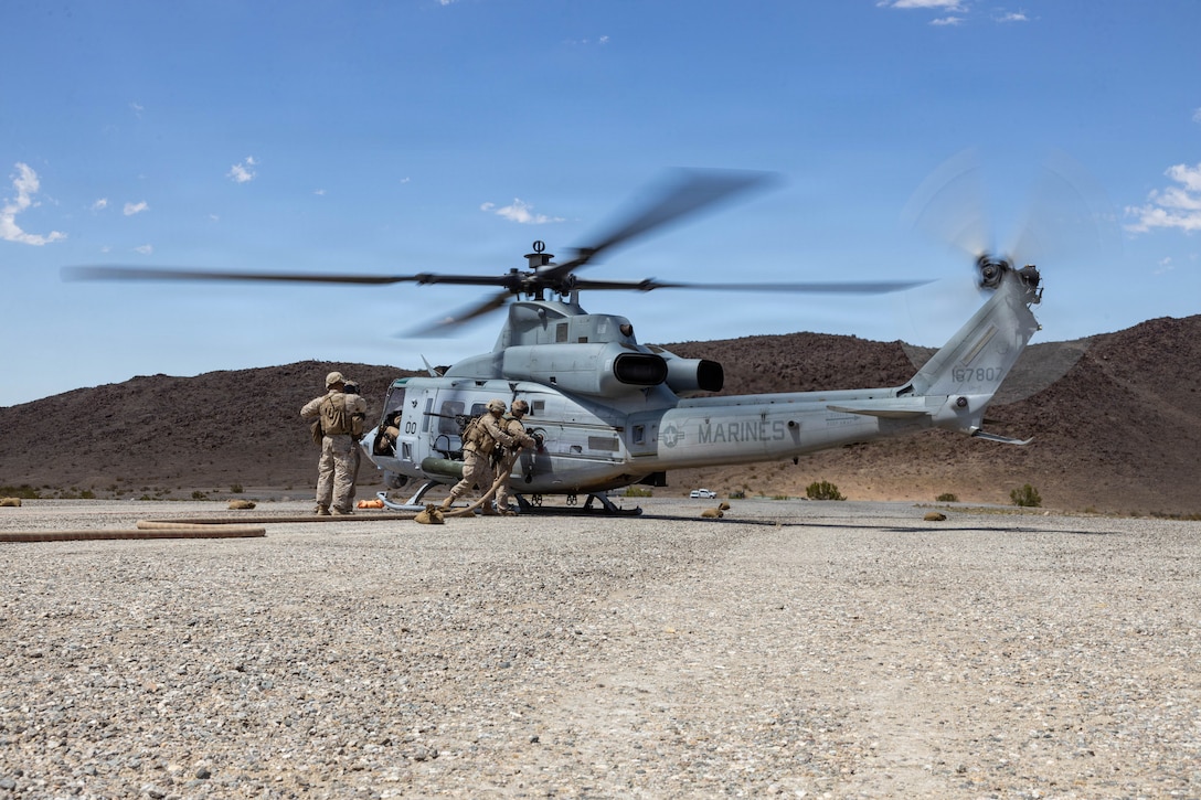 A UH-1 Venom prepares to land during a Forward Arming and Refueling Point exercise as part of Service Level Training Exercise 3-26 at training area Cleghorn, Marine Corps Air Ground Combat Center, Twentynine Palms, California, June 15, 2026. Service level training exercise assesses Marine Air Ground Task Forces abilities to plan, coordinate and execute large-scale operations by integrating command and control, maneuver, sustainment and live-fire events in realistic training environments. (U.S. Marine Corps photo by Lance Cpl. Cody Fitzgerald)