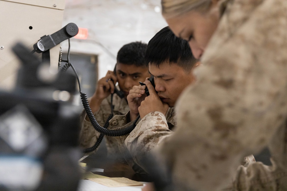 U.S. Marine Corps Cpl. Man Nguyen, network transport technician with Marine Wing Support Squadron 473, Marine Aircraft Group 41, 4th Marine Aircraft Wing, conducts radio checks during a Command Post Exercise as part of Integrated Training Exercise 3-26 at the Strategic Expeditionary Landing Field, Marine Corps Air Ground Combat Center, Twentynine Palms, California, June 5, 2026. ITX is designed to generate combat readiness and ensure the Reserve Component provides critical strategic depth to the Total Force. From complex combined arms maneuvers to all-domain integration, these Marines are proving that they are ready to augment, reinforce, and fight alongside the active component at a moment's notice. (U.S. Marine Corps photo by Lance Cpl. Lainey Brummett)