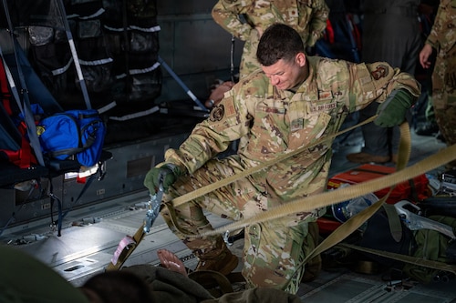 Airmen tightens strap