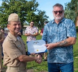 (left) Capt. Paul Stence, Jr., Naval Surface Warfare Center Panama City Division (NSWC PCD) commanding officer, recognizes Louis Barba, NSWC PCD Assault Craft Unit 5 Ship to Shore Connector pilot, with the Department of the Navy Civilian Service Achievement Medal for ensuring critical assets were delivered on time to the fleet, June 12. Accepting the award on his behalf was Skip Whitmore, NSWC PCD Landing Craft Air Cushion Support Services project manager. (U.S. Navy photo by Eddie Green)