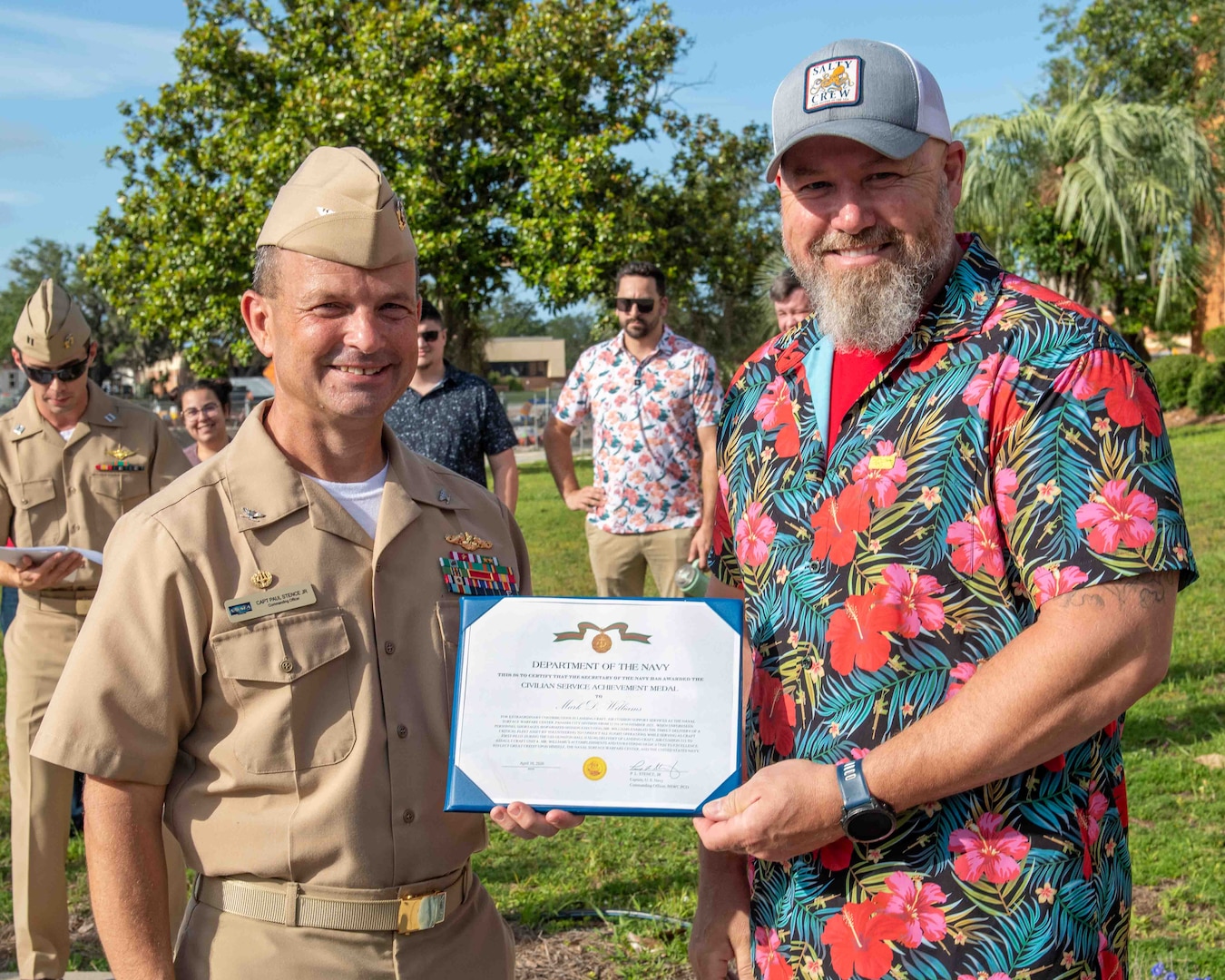 (left) Capt. Paul Stence, Jr., Naval Surface Warfare Center Panama City Division (NSWC PCD) commanding officer, presents Mark Williams, NSWC PCD Landing Craft Air Cushion (LCAC) test pilot, with the Department of the Navy Civilian Service Achievement Medal, June 12. His efforts ensured the successful delivery of four LCAC craft from NSWC PCD to Assault Craft Unit Four (ACU-4) via the USS Gunston Hall (LSD-44). (U.S. Navy photo by Eddie Green)