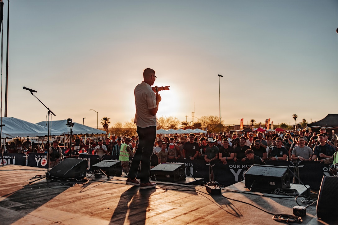 U.S. Marine Corps Sgt. Maj. Carlos A. Ruiz, the 20th Sergeant Major of the Marine Corps, delivers opening remarks before the We Salute You concert at Marine Corps Air Ground Combat Center, Twentynine Palms, California, May 8, 2026. The We Salute You event run by Marine Corps Community Services is a free military appreciation event designed to honor the service of military families aboard MCAGCC. (U.S. Marine Corps photo by Lance Cpl. Parker Peichel)
