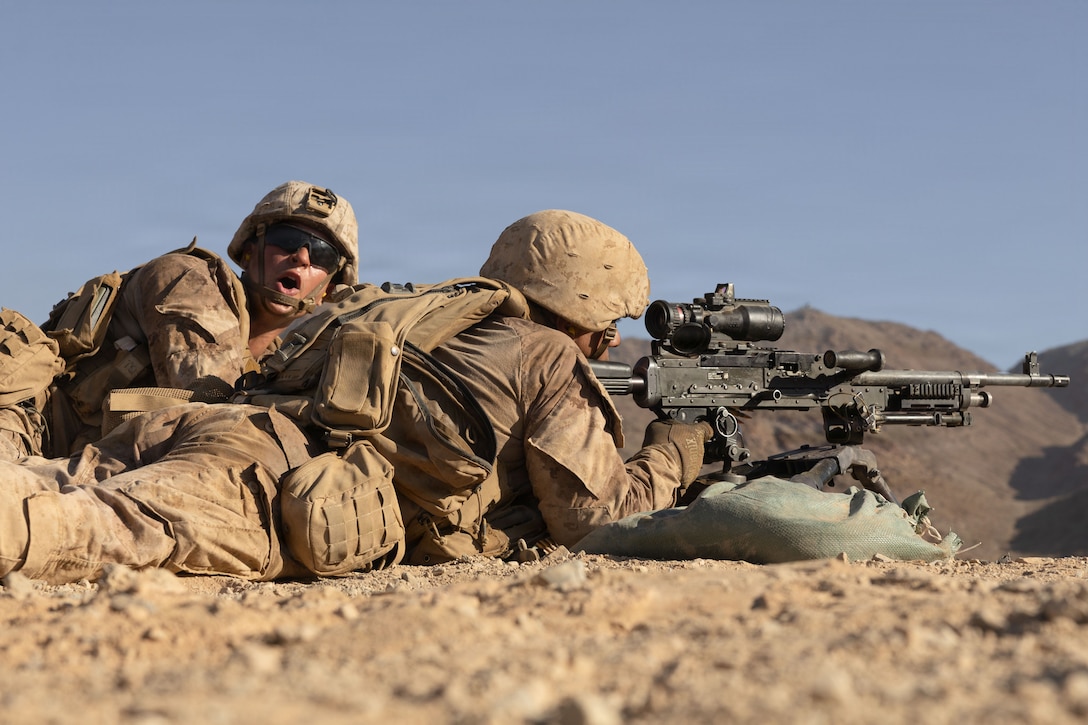 U.S. Marine Corps Lance Cpl. Aiden Portis, left, and Pfc. Cameron Wallace with 1st Battalion, 24th Marine Regiment, 4th Marine Division, provides suppressive fire with an M240B machine gun during Integrated Training Exercise 3-26 at Range 400, Marine Corps Air Ground Combat Center Twentynine Palms, California, June 10, 2026. ITX is designed to generate combat readiness and ensure the Reserve Component provides critical strategic depth to the Total Force. From complex combined arms maneuvers to all-domain integration, these Marines are proving that they are ready to augment, reinforce, and fight alongside the active component at a moment's notice. (U.S. Marine Corps photo by Pfc. Ethan DePaul)