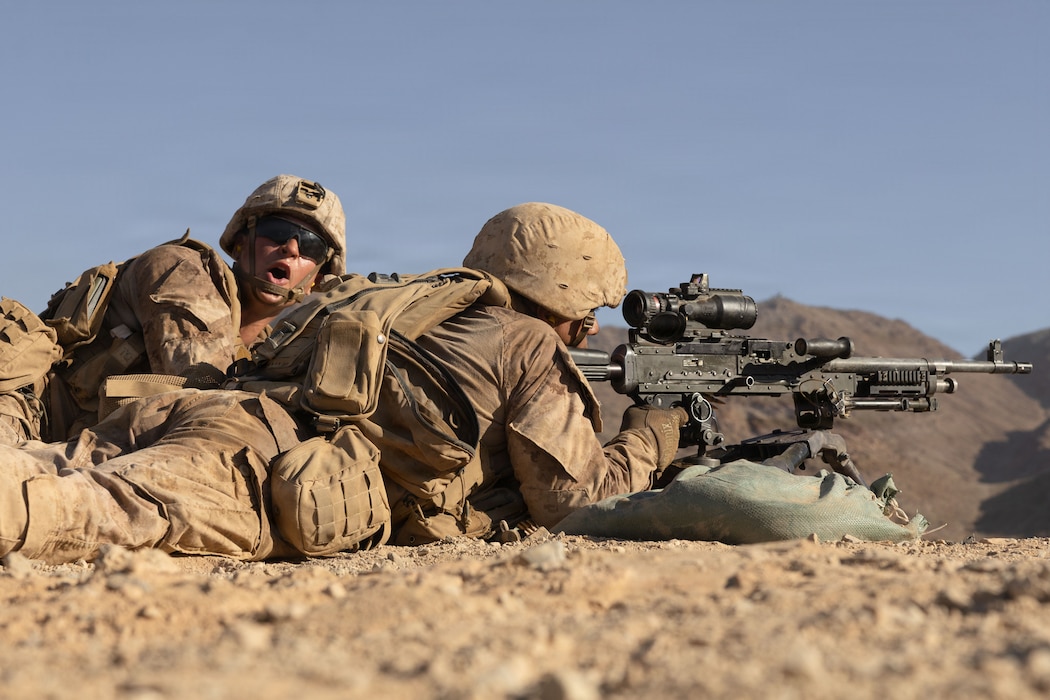 U.S. Marine Corps Lance Cpl. Aiden Portis, left, and Pfc. Cameron Wallace with 1st Battalion, 24th Marine Regiment, 4th Marine Division, provides suppressive fire with an M240B machine gun during Integrated Training Exercise 3-26 at Range 400, Marine Corps Air Ground Combat Center Twentynine Palms, California, June 10, 2026. ITX is designed to generate combat readiness and ensure the Reserve Component provides critical strategic depth to the Total Force. From complex combined arms maneuvers to all-domain integration, these Marines are proving that they are ready to augment, reinforce, and fight alongside the active component at a moment's notice. (U.S. Marine Corps photo by Pfc. Ethan DePaul)
