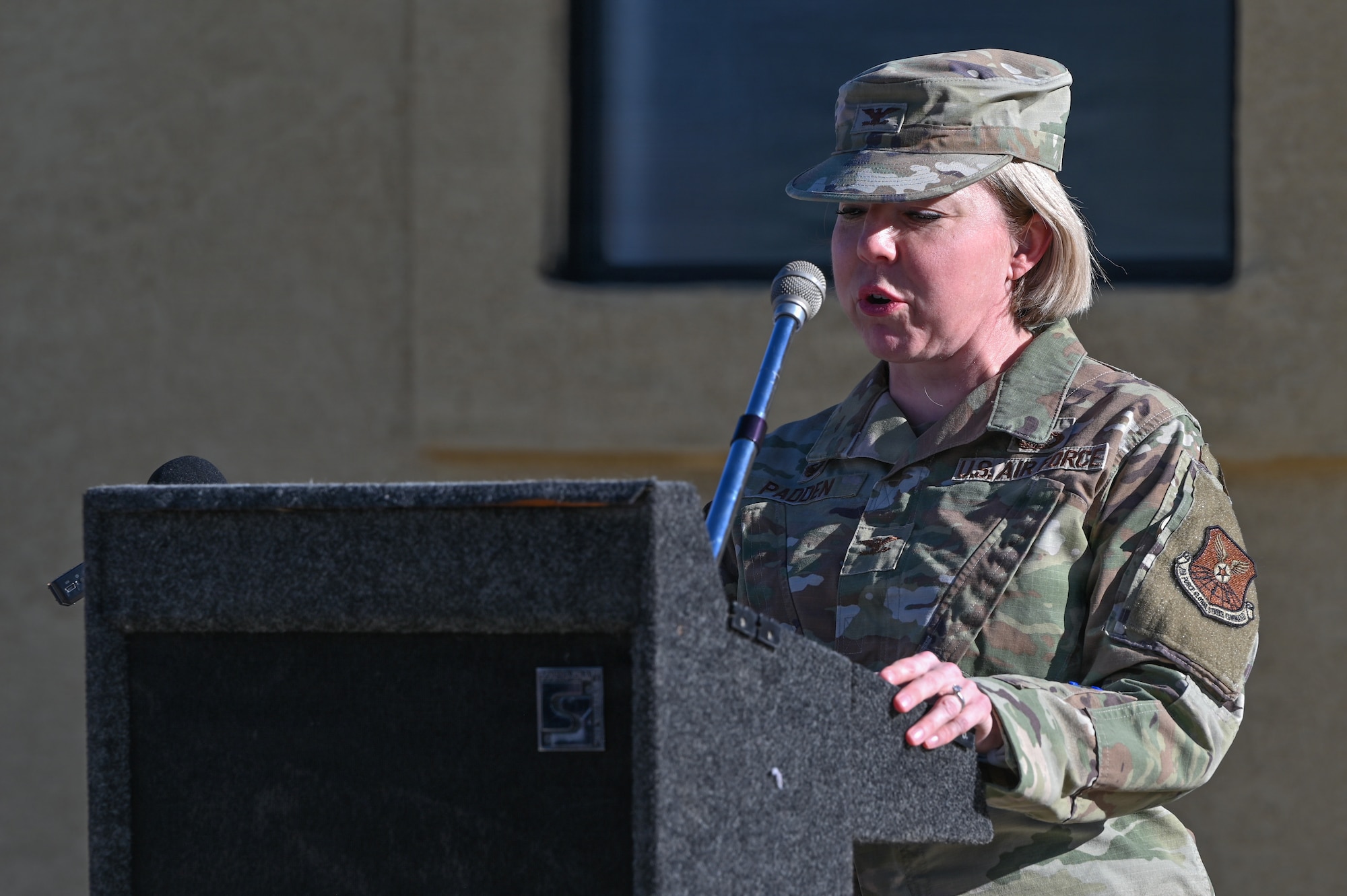 U.S. Air Force Col. Kelly Padden, 377th Mission Support Group commander gives opening remarks at the Pershing Housing Renovation Completion Ribbon Cutting at Kirtland Air Force Base.