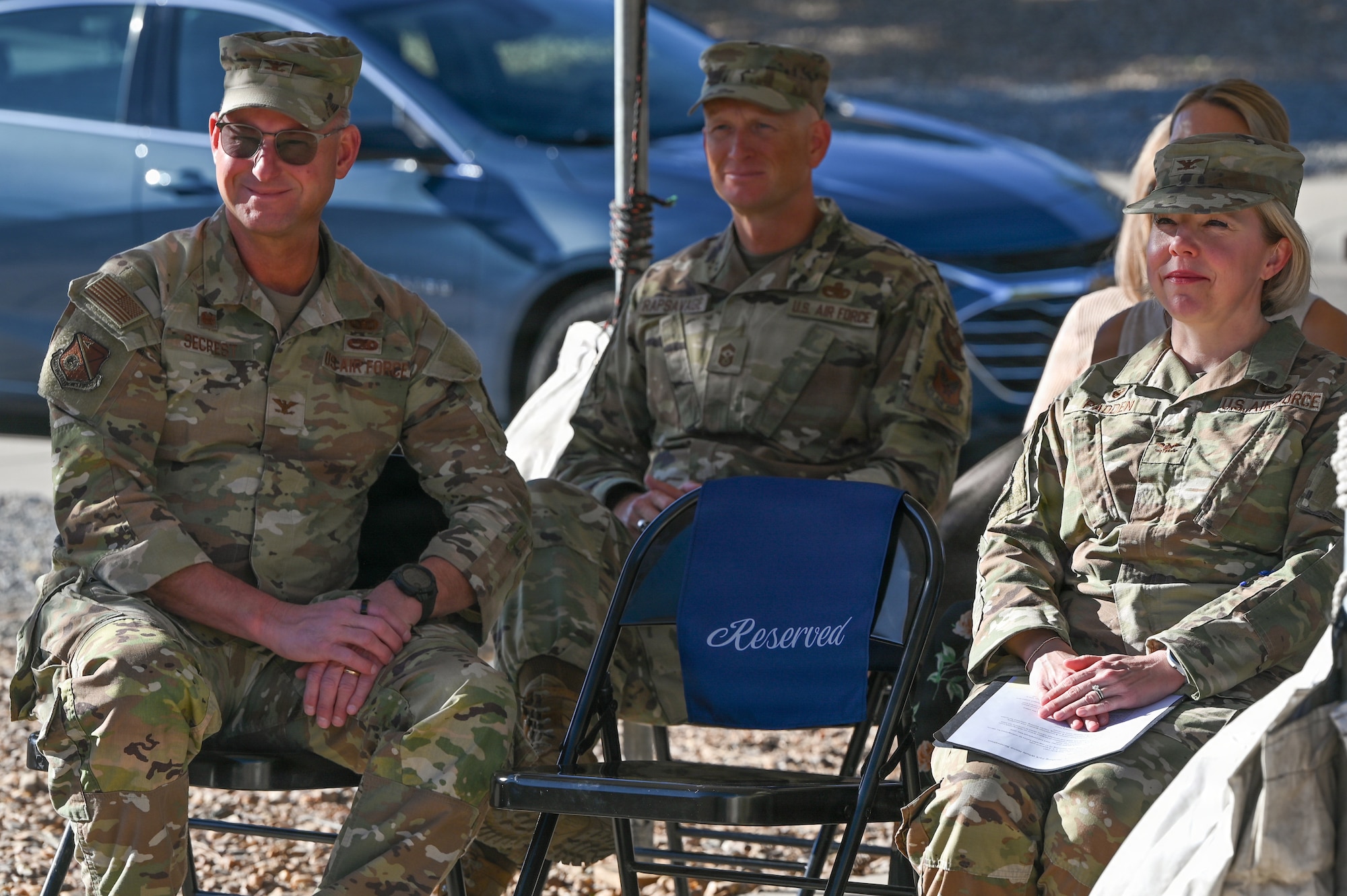 U.S. Air Force Col. Justin D. Secrest, 377 Air Base Wing and installation commander, left, Chief Master Sgt. Andrew Rapsavage, 377 ABW command chief master sergeant, middle, and Col. Kelly Padden, 377th Mission Support Group commander, attend the Pershing Housing Renovation Completion Ribbon Cutting at Kirtland Air Force Base, New Mexico.
