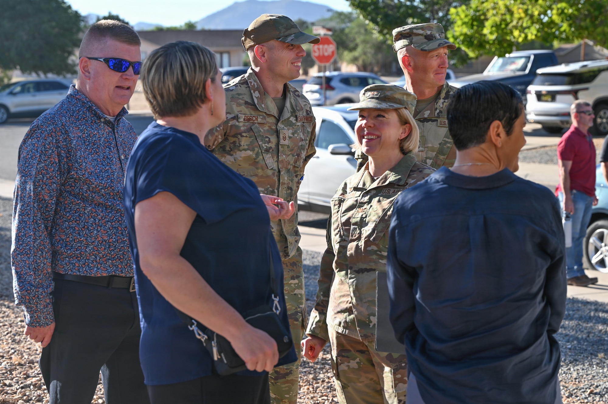 U.S. Air Force Col. Kelly Padden, 377th Mission Support Group commander speaks with members of 377th Civil Engineer Squadron at the Pershing Housing Renovation Completion Ribbon Cutting at Kirtland Air Force Base.