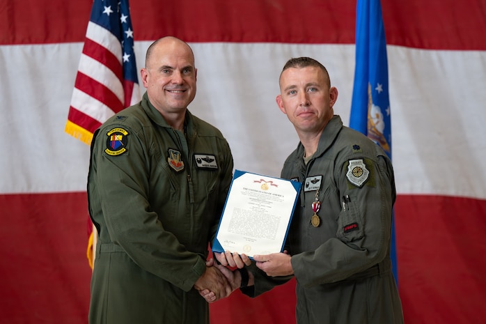 people holding certificate