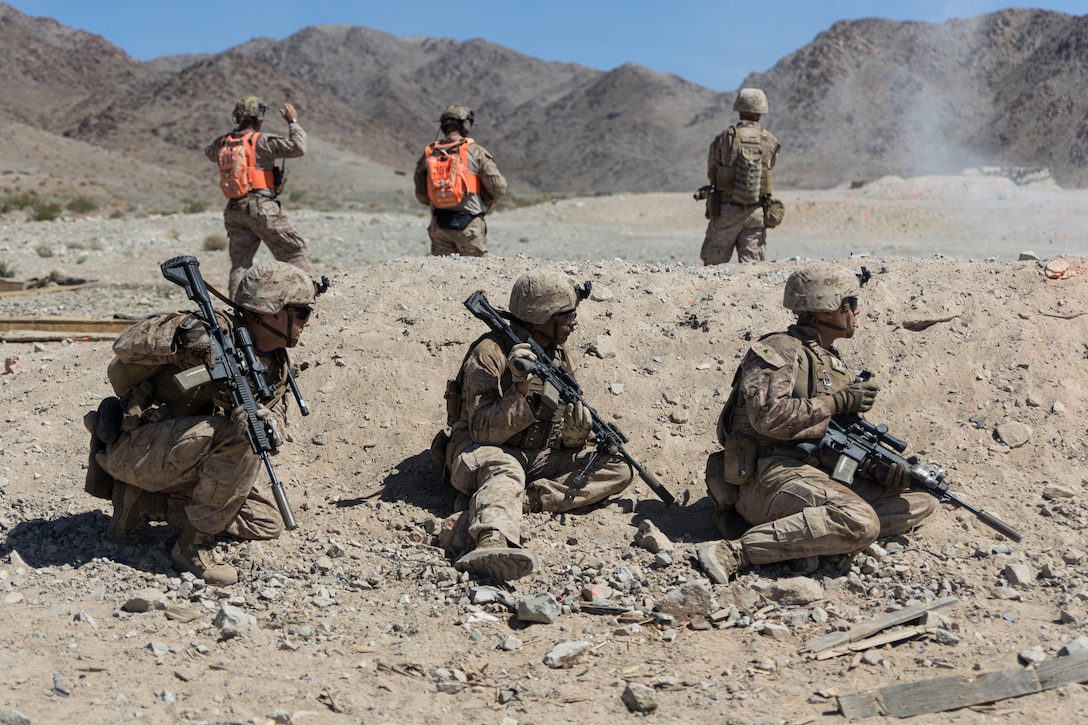 U.S. Marines with Tactical Training and Exercise Control Group, Marine Corps Air Ground Task Force Training Command, Marine Corps Air Ground Combat Center, and 2nd Battalion, 24th Marine Regiment, 4th Marine Division, take cover during live fire platoon attacks at Range 410A as part of Integrated Training Exercise 3-26, MCAGCC, Twentynine Palms, California, June 11, 2026. ITX is designed to generate combat readiness and ensure the Reserve Component provides critical strategic depth to the Total Force. From complex combined arms maneuvers to all-domain integration, these Marines are proving that they are ready to augment, reinforce, and fight alongside the active component at a moment's notice. (U.S. Marine Corps photo by Lance Cpl. Lainey Brummett)