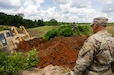 First Army Soldiers provide OC/T support to U.S. Army Reserve engineers as they construct a fighting position during Operation Sentinel Justice.
