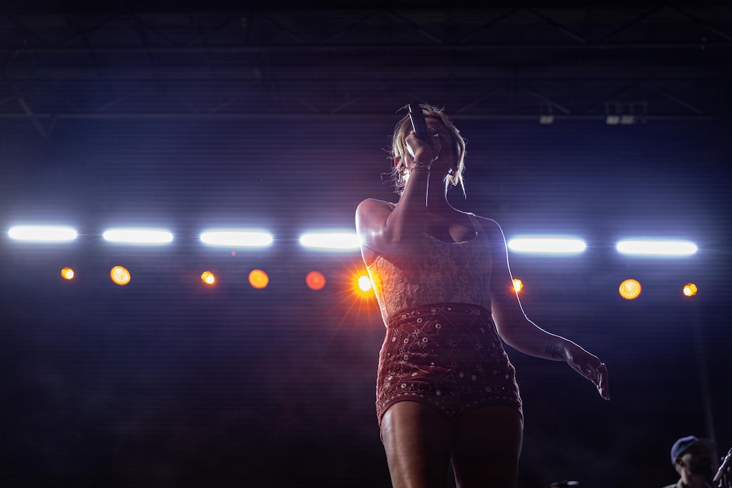 Carly Pearce, a musician, performs during the We Salute You concert at Marine Corps Air Ground Combat Center, Twentynine Palms, California, May 8, 2026.  The We Salute You event run by Marine Corps Community Services is a free military appreciation event designed to honor the service of military families aboard MCAGCC. (U.S. Marine Corps photo by Lance Cpl. Parker Peichel)
