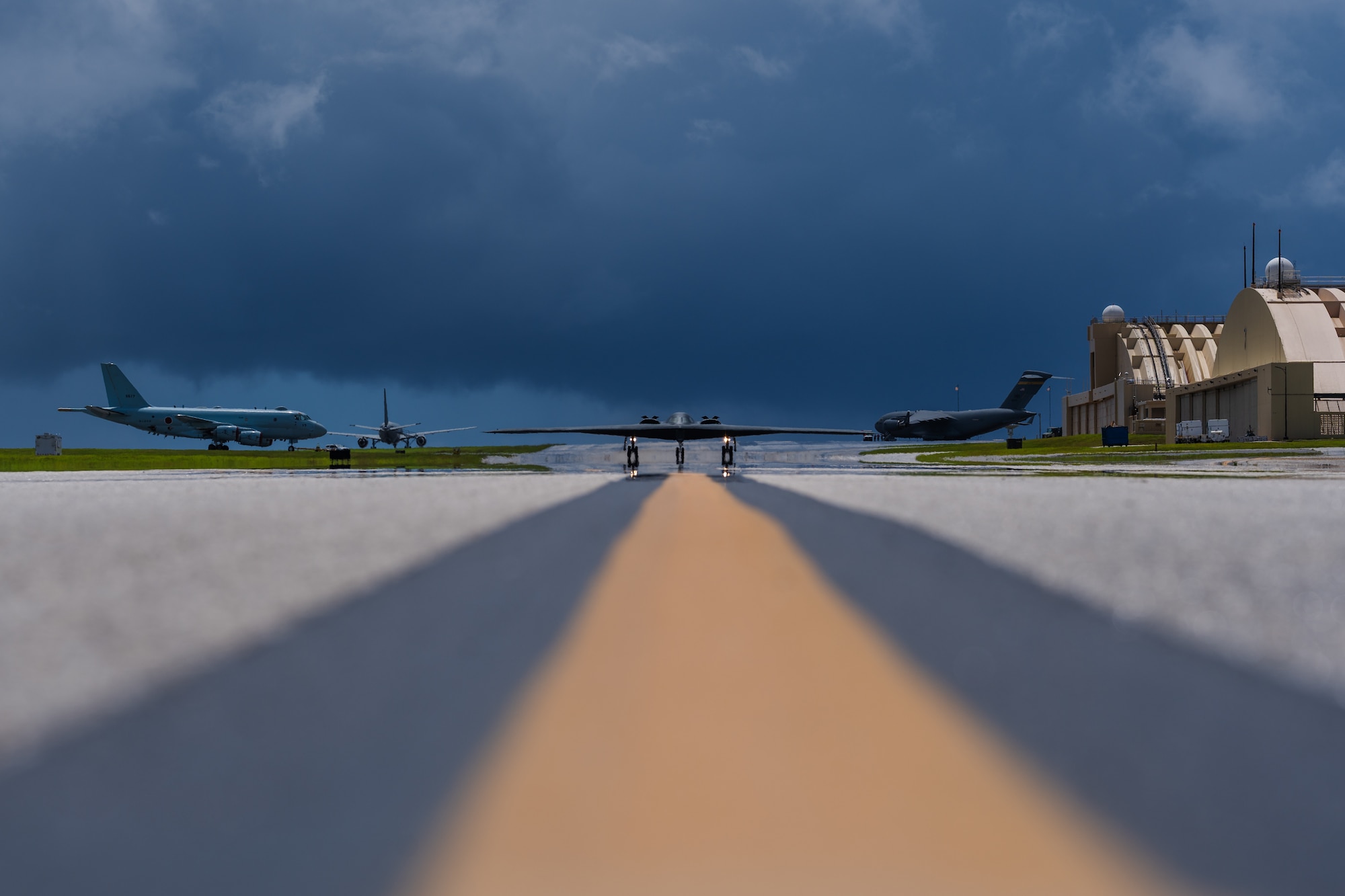 A stealth bomber taxis on an airfield