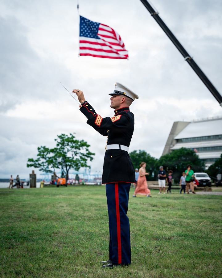 NORFOLK, Va. (June 19, 2026) Staff Sgt. Nathaniel Hawkins assigned to the 2nd Marine Aircraft Wing (MAW) Band conducts the band during the national anthem at the Norfolk Harborfest Parade of Sail, June 19, 2026. FLEETEX 250 represents the United States’ commitment to layer defense of the homeland through forward-deployed forces and reinforces interoperability with allies and partners through collective maritime security. (U.S. Navy photo by Mass Communication Specialist 2nd Class Derek Cole)