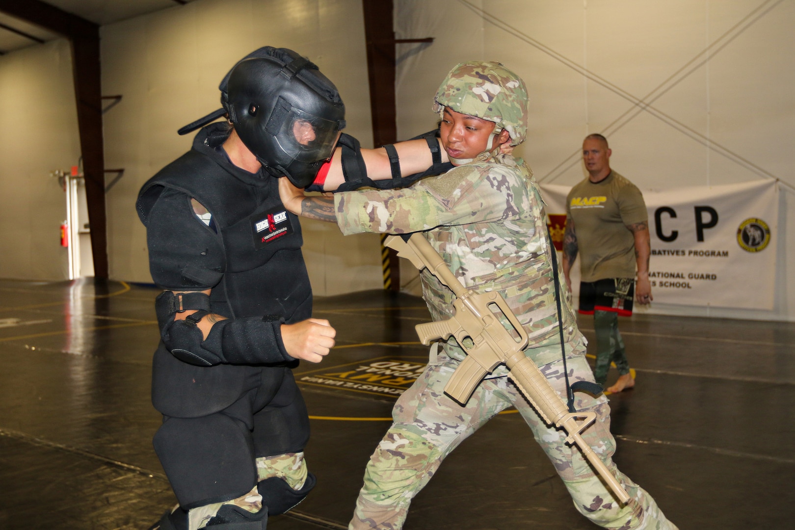 U.S. Army Soldiers participating in the Pennsylvania National Guard State Combatives Program's Basic Combatives Course demonstrate close-quarters combat techniques during the course's culminating training event at Fort Indiantown Gap, Pennsylvania, June 26, 2026.