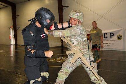 U.S. Army Soldiers participating in the Pennsylvania National Guard State Combatives Program's Basic Combatives Course demonstrate close-quarters combat techniques during the course's culminating training event at Fort Indiantown Gap, Pennsylvania, June 26, 2026.