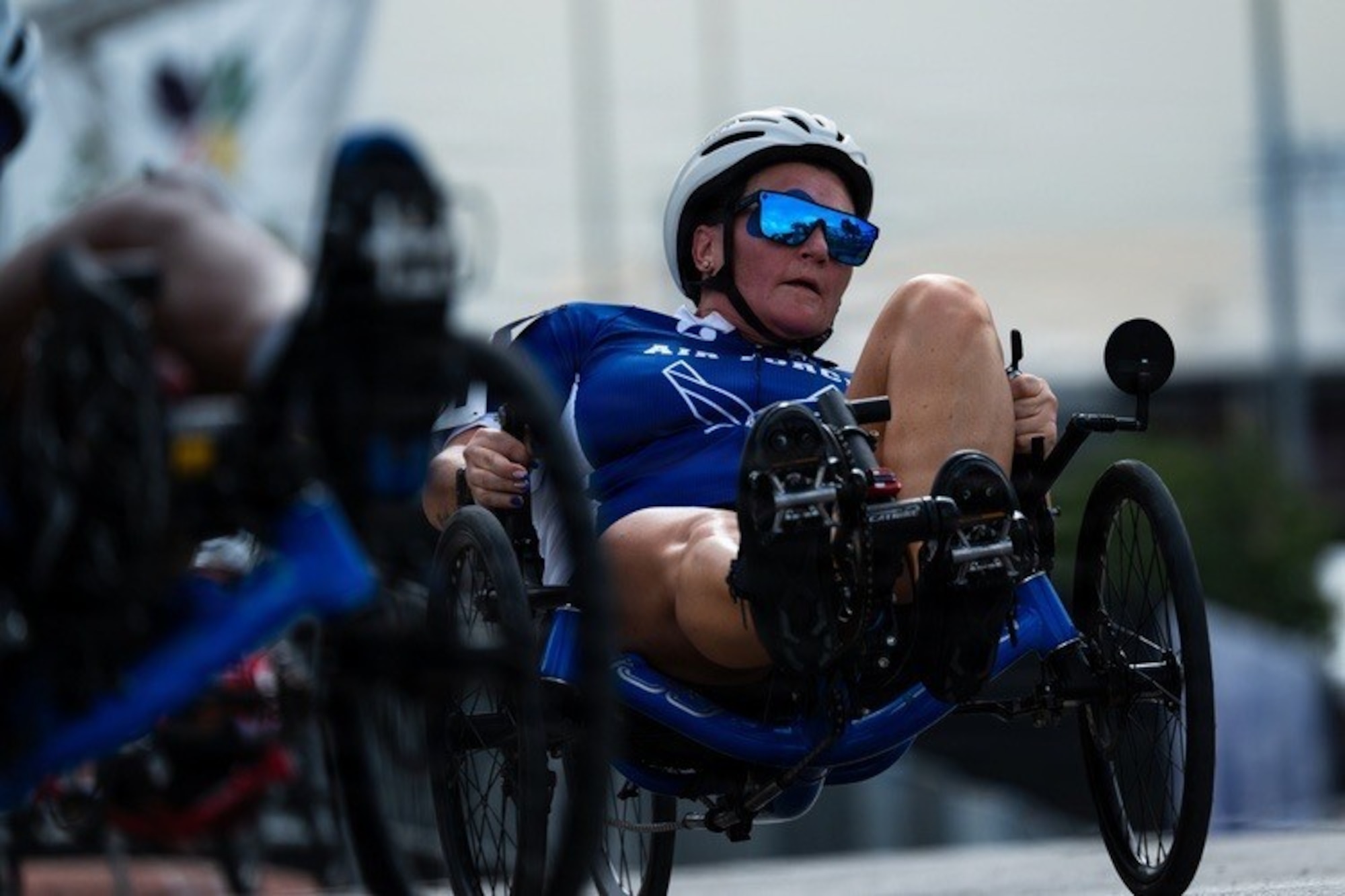 Chief Master Sgt. Danielle Spurlock rides a recumbent bike.