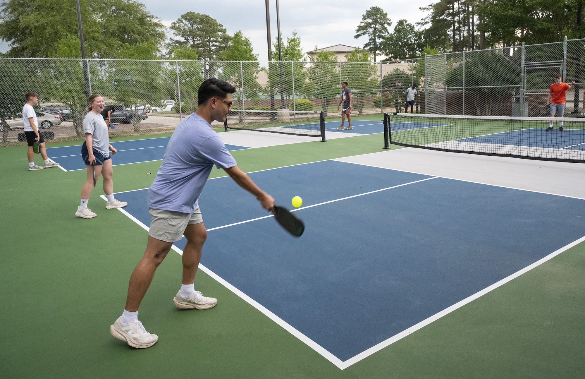 Airmen play pickleball.
