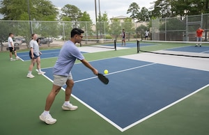 Airmen play pickleball.