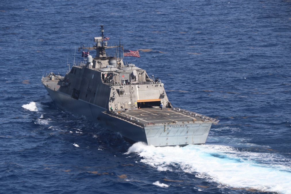 A navy ship in the water.
