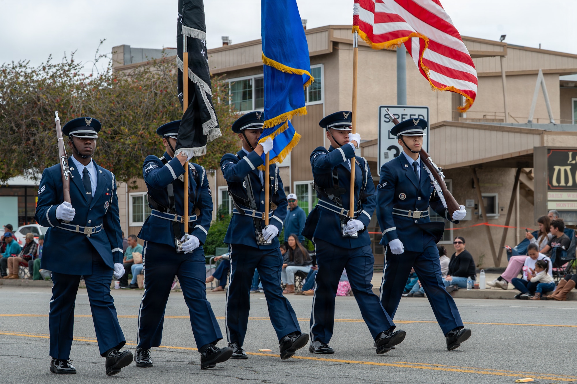 Vandenberg Honor Guard walk on the road in line with each other