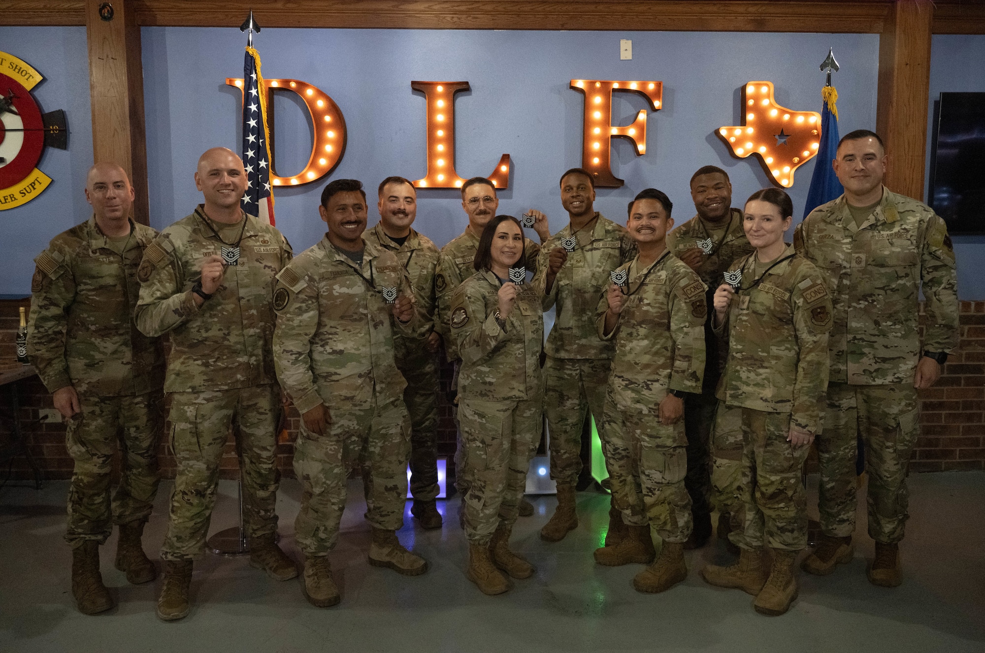 The 47th Flying Training Wing’s newest technical sergeant selects and base leadership pose for a group photo during a Technical Sergeant Release Party at Laughlin Air Force Base, Texas, June 26, 2026. Air Force officials selected 6,668 Air Force Staff Sergeants for promotion to Technical Sergeant out of 25,080 eligibles for a selection rate of 26.59 percent in the 26E6 promotion cycle. (U.S. Air Force photo by Airman 1st Class Darryl Keith)