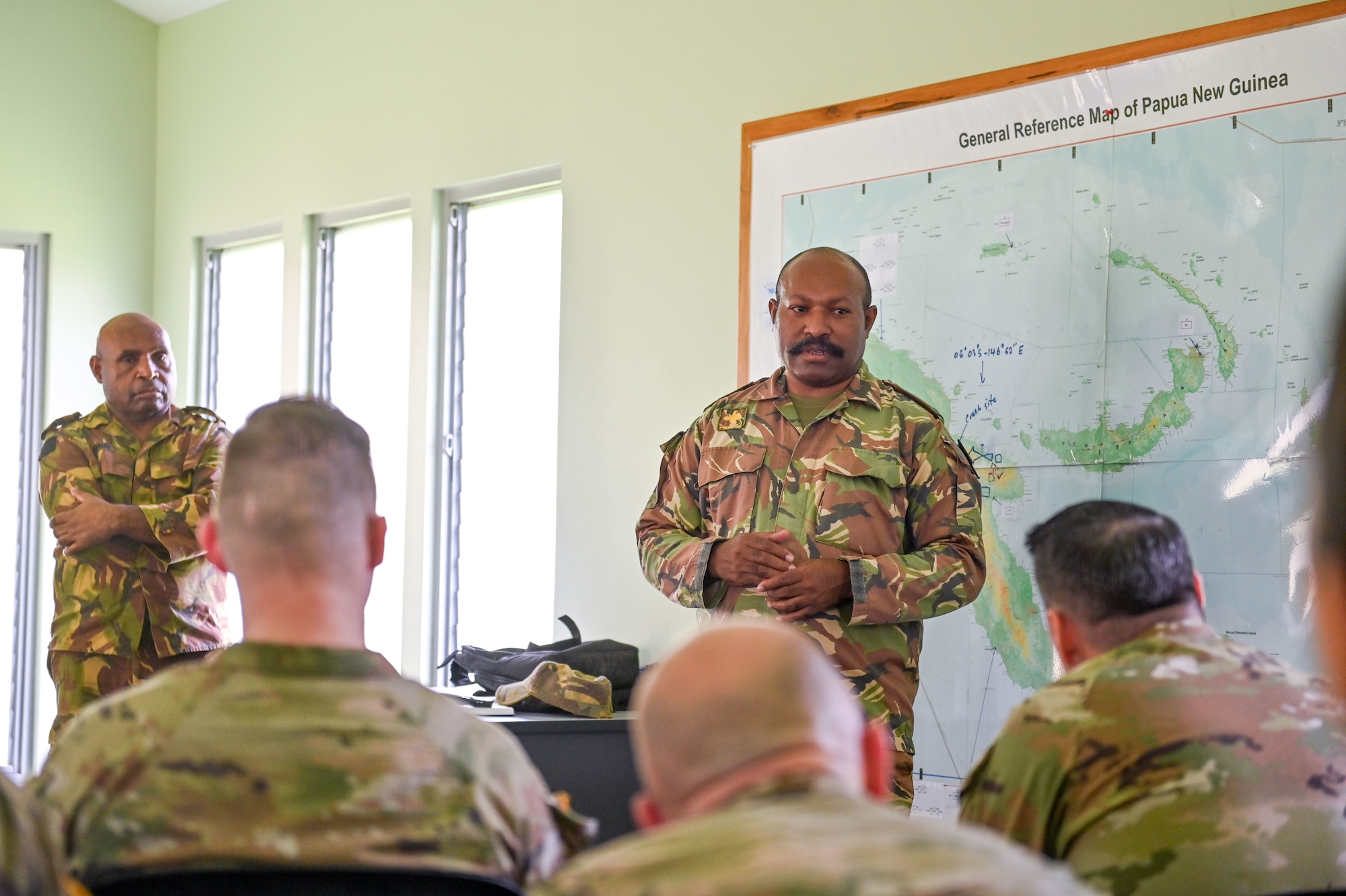 Papua New Guinea Defence Force Major Elvis Toba, the PNGDF Director of Military Police, gives a security briefing to members of the Wisconsin National Guard upon their arrival for the March 2025 Consolidated State Partnership Program Exchange at Murray Barracks in Port Moresby, Papua New Guinea on March 11, 2025. The Wisconsin National Guard State Partnership Program is working with the U.S. Embassy team in PNG, and the PNG Defence Force on a consolidated exchange in Papua New Guinea during fiscal year 2025 that includes four subject matter expert exchanges. (U.S. Air National Guard photo by Master Sgt. Mary Greenwood)
