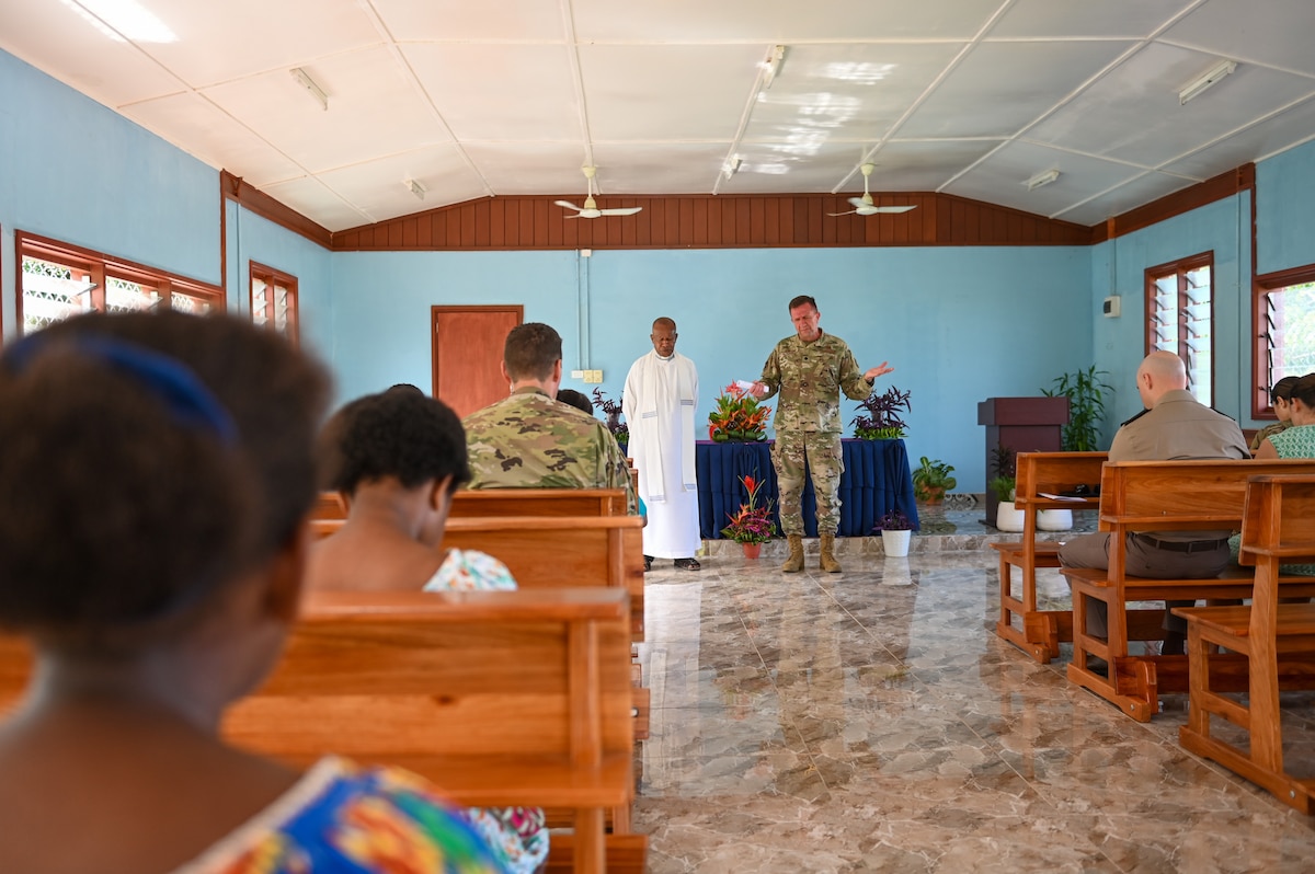 Papua New Guinea Defence Force Captain Benstead Bareta, assigned to the PNGDF Air Transport Wing, left, and U.S. Air Force Lt. Col. James Buckman, assigned to the 115th Fighter Wing, Wisconsin Air National Guard, lead a religious service at Eagle Wing Chapel, Kiki Barracks, PNGDF Air Transport Wing, in the National Capitol District, Port Moseby, Papua New Guinea March 16, 2025. The Wisconsin National Guard State Partnership Program is working with the U.S. Embassy team in PNG and the PNGDF on a consolidated exchange in PNG during fiscal year 2025 that includes four subject matter expert exchanges. (U.S. Air National Guard photo by Master Sgt. Mary Greenwood)