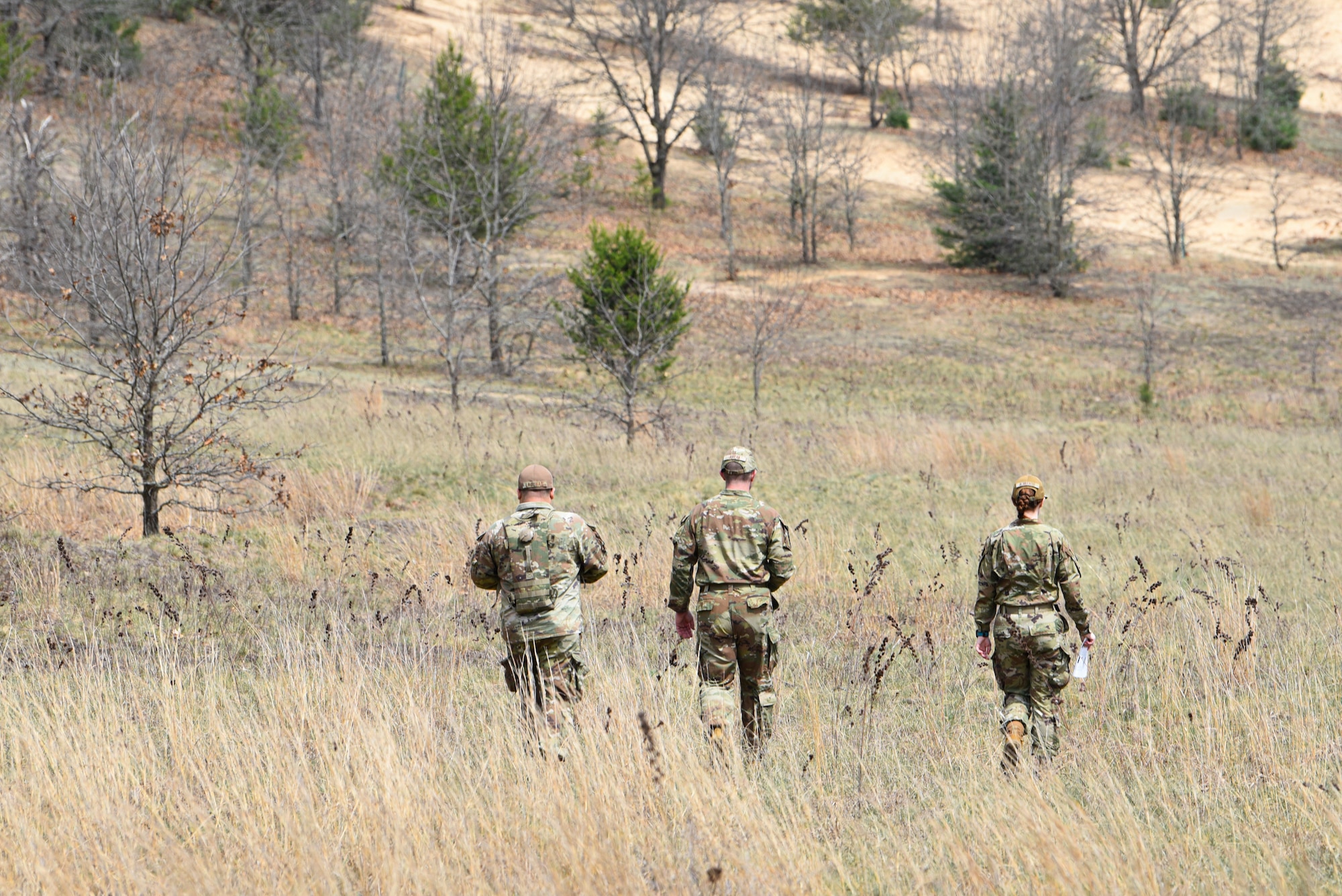 U.S. Air Force emergency management specialists, Air National Guard, practice land navigation during CHOP North 26, April 17, 2026, at Volk Field, Camp Douglas, Wis. CHOP North 26 provides the opportunity for Airmen to come together and conduct multi-capability training. (U.S. Air National Guard photo by Master Sgt. Mary Greenwood)