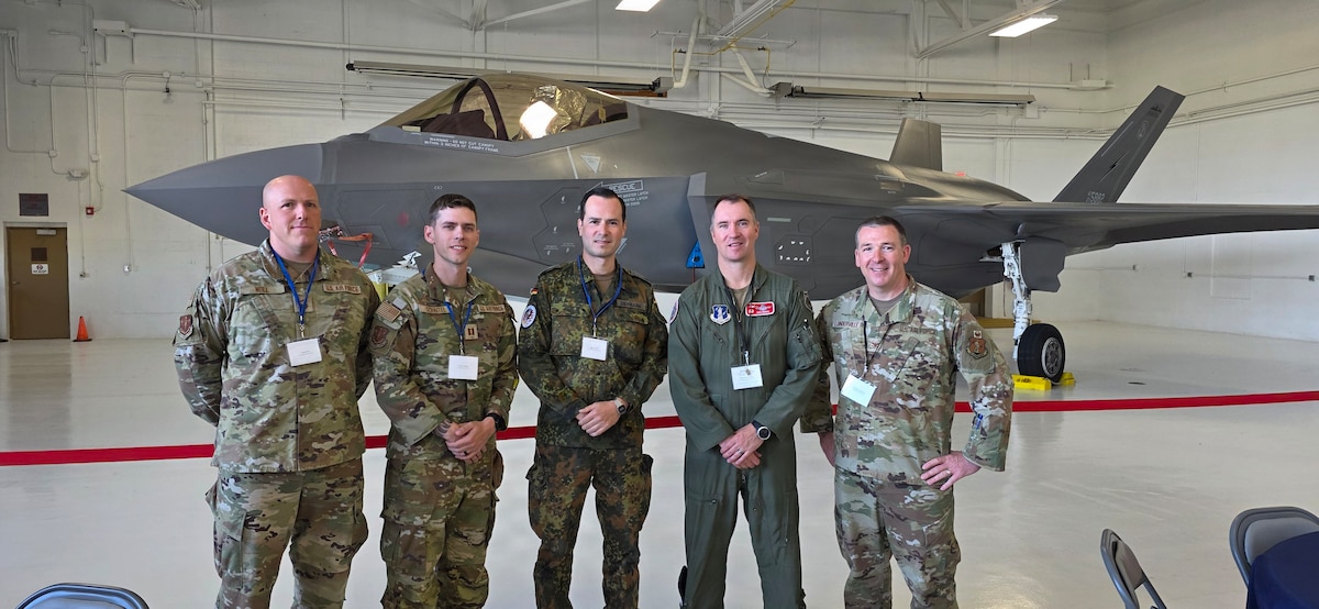 German Air Force Maj. Robert Diekmann, a force protection officer assigned to the German Air Force Headquarters in Berlin, stands with 115th Fighter Wing Airmen and leadership June 4, 2026 at Volk Field Air National Guard Base, Wisconsin. Diekmann embedded with the 115th Fighter Wing in Madison, Wisconsin as part of a two-week Military Reserve Exchange Program that helps foster relationships and strengthen NATO partnerships and alliances.(U.S. Air National Guard courtesy photo)