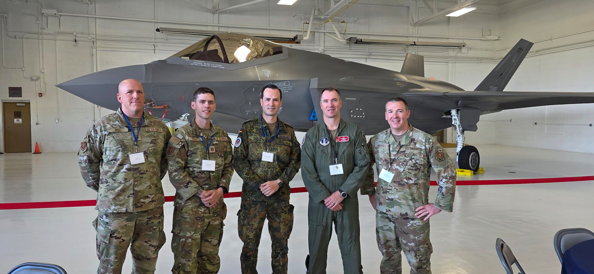 German Air Force Maj. Robert Diekmann, a force protection officer assigned to the German Air Force Headquarters in Berlin, stands with 115th Fighter Wing Airmen and leadership June 4, 2026 at Volk Field Air National Guard Base, Wisconsin. Diekmann embedded with the 115th Fighter Wing in Madison, Wisconsin as part of a two-week Military Reserve Exchange Program that helps foster relationships and strengthen NATO partnerships and alliances.(U.S. Air National Guard courtesy photo)